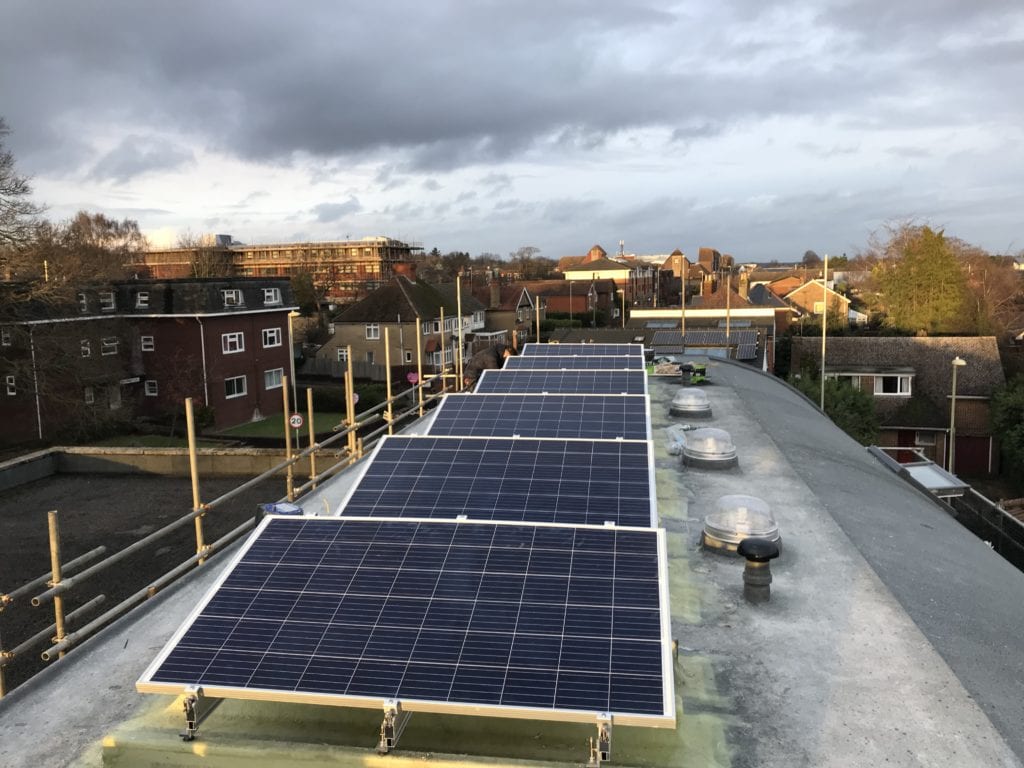 Solar panels on flat roof before final roof coating