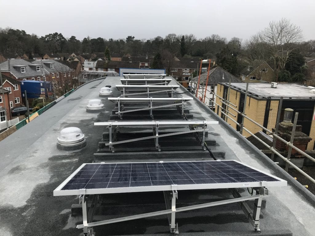 Back view of solar panels on flat roof
